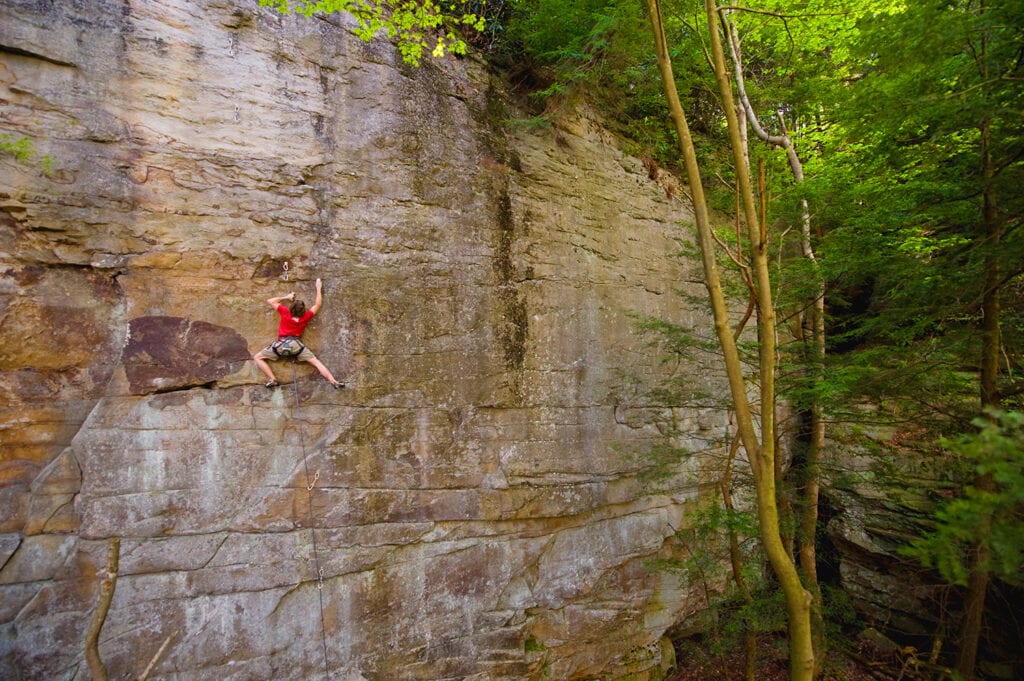 Climber on a sandstone wall in Red River Gorge