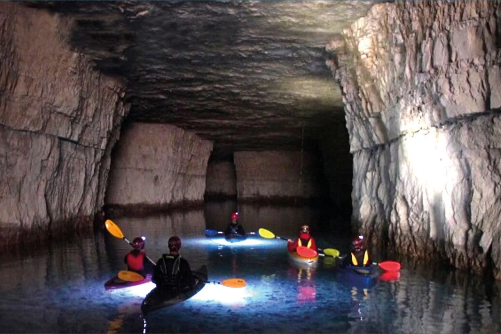 Kayakers paddling underground at The Gorge Underground
