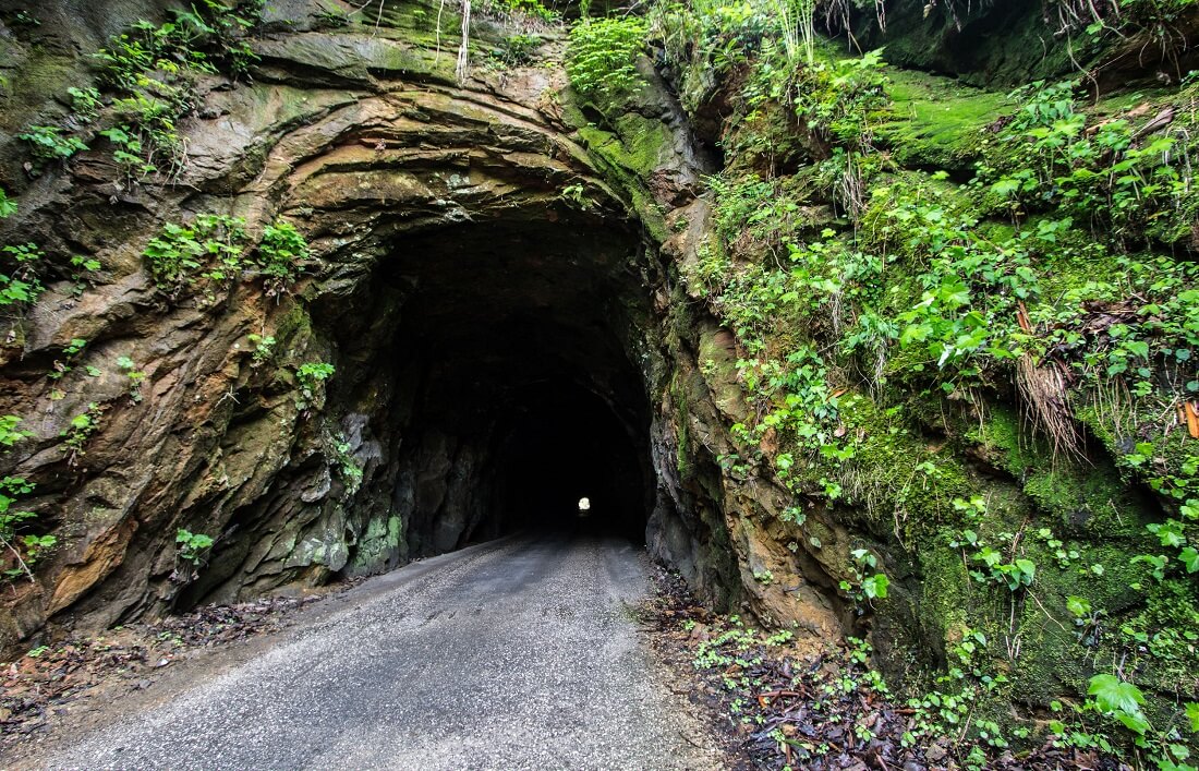 Mossy stone entrance to Nada Tunnel in Daniel Boone National Forest