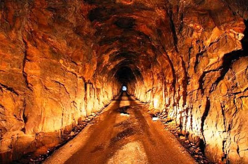 Long view down the lit interior of Nada Tunnel