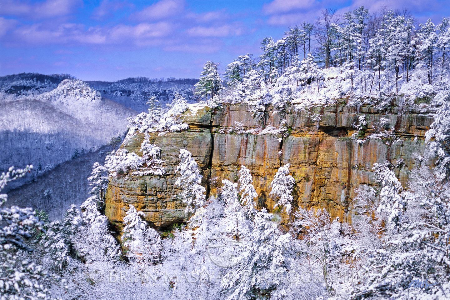 Snow-covered sandstone cliffs at Red River Gorge in winter